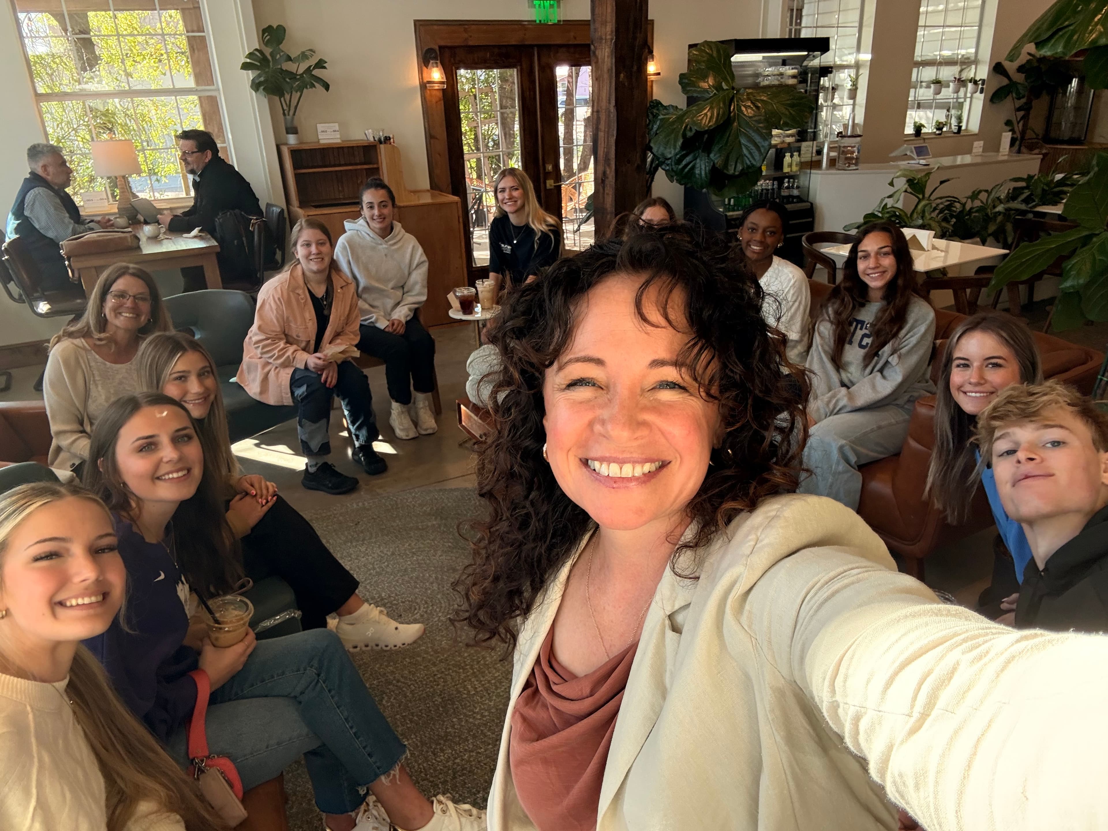 Christin surrounded by the Manna Bakery community