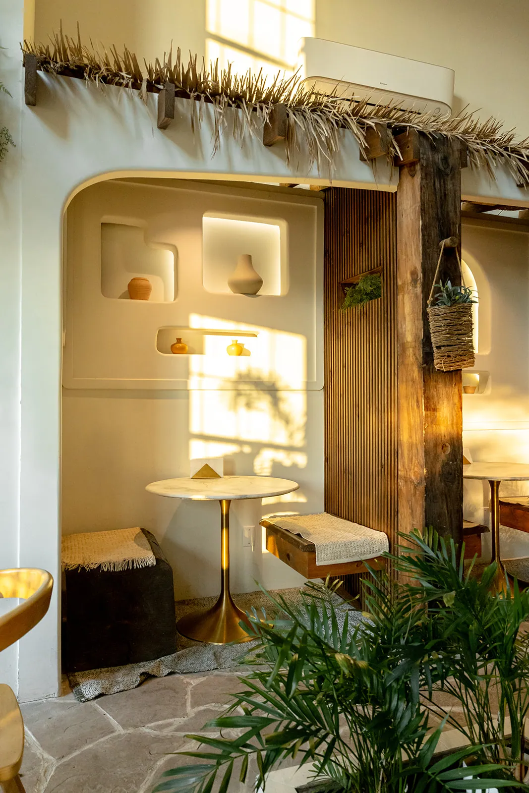 A softly lit arched alcove inside Manna Bakery