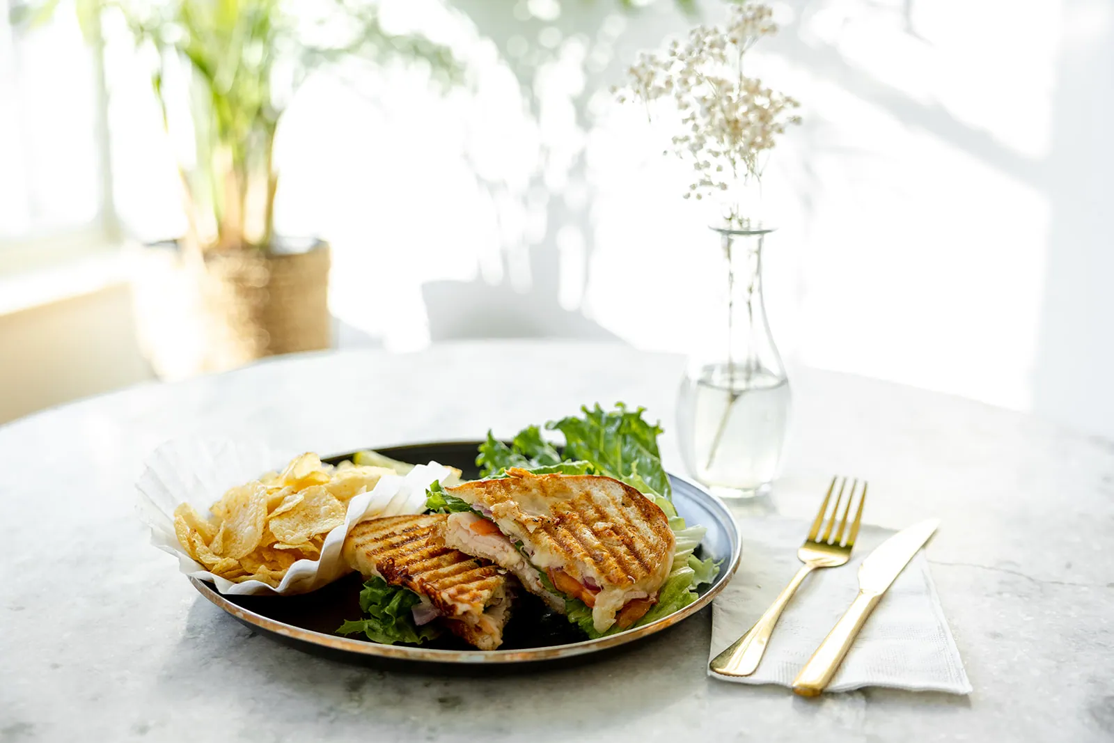 Turkey pesto panini sandwiches plated for catering